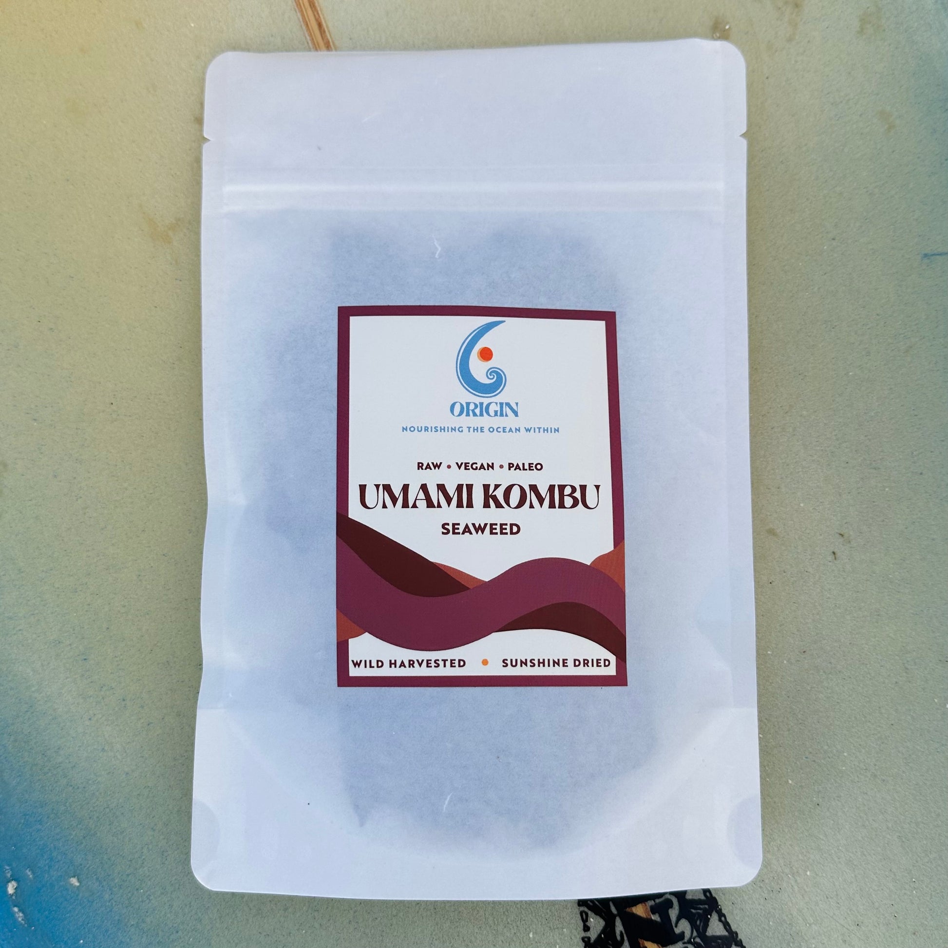 origin seaweed umami kombu compostable retail bag on surfboard